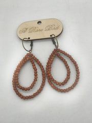 Pumpkin Teakwood Earrings. Robin Boutique